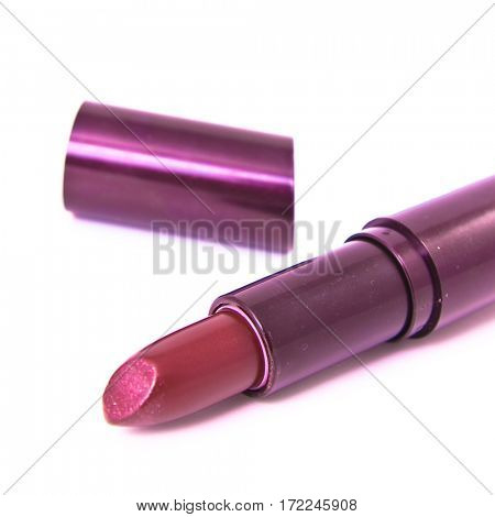 open lipstick on white background