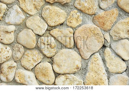 Background with stone wall from yelow rock material