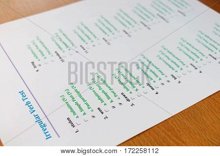 multiple choice english exam on wooden table