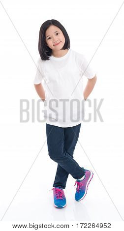 Cute Asian girl in white t-shirt and jeans standing on white background isolated