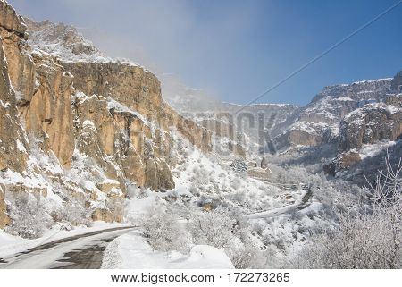 A winter panorama of Geghard Monastery unique architectural construction and a UNESCO World Heritage in Armenia.