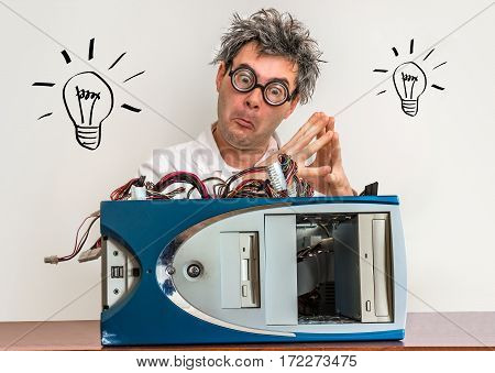 Crazy Engineer Or Scientist Repairing Computer With Bulb Symbol