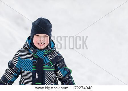 Portrait of little boy in winter time.