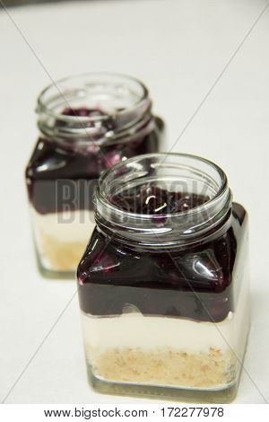 A Blueberry filling and creamcheese served in glass