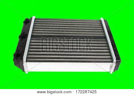 Engine cooling radiator isolated on green background. Auto spare parts for passenger car. Chromakey