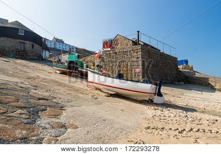Small fishing boats in the harbour at Sennen Cove Cornwall England UK Europe