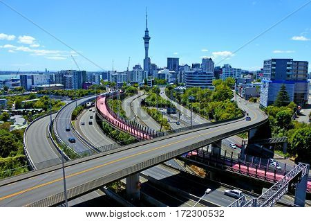 AUCKLAND - FEB 11 2017: Urban aerial landscape view of traffic on Auckland city motorway. It is the most populous urban area in New Zealand.