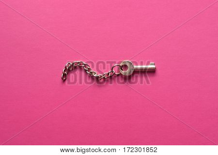Golden Key On A Pink Background.