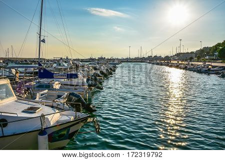 ROCCELLA IONICA, ITALY - September 30, 2016: Port of Roccella Ionica in the evening with fishing boats and luxury yachts. Port of Ionian Sea, Calabria, south Italy.