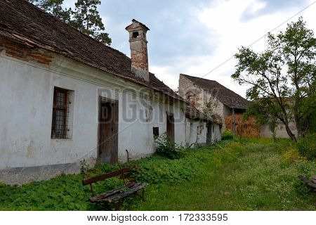 Courtyard of the church. Ungra is a commune in Braşov County, Romania. In Ungra there is a medieval 13th century Transylvanian Saxon church and many old houses