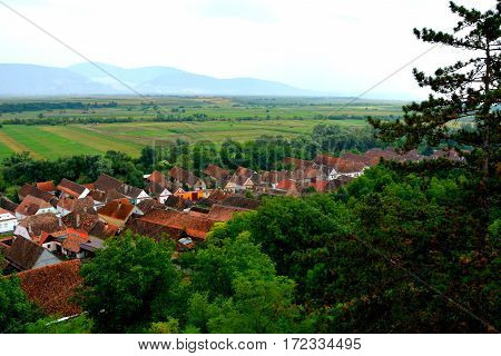 Aerial view of the village Ungra, a commune in Braşov County, Romania. In Ungra there is a medieval 13th century Transylvanian Saxon church and many old houses.