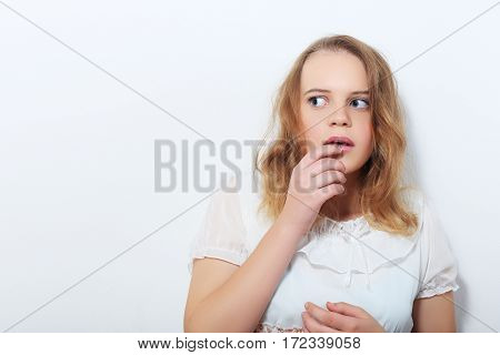 teenager girl looking outside the picture with fear on her face