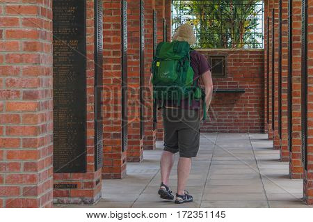 Labuan,Malaysia-April 1,2016:Tourist with backpack at Veteran Memorial Park in Labuan,Malaysia.Labuan island once known as The Pearl of The Orient is one of the World War II allied stronghold and become Jap