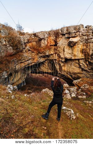 woman tourist traveling through Romania. God's Bridge