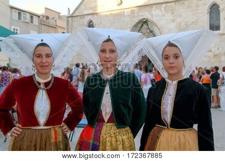 Girls On Traditional Clothes During A Celebration At Pag