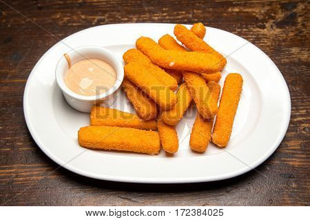 Traditional beer snack sticks with mozzarella cheese deep fried with sauce