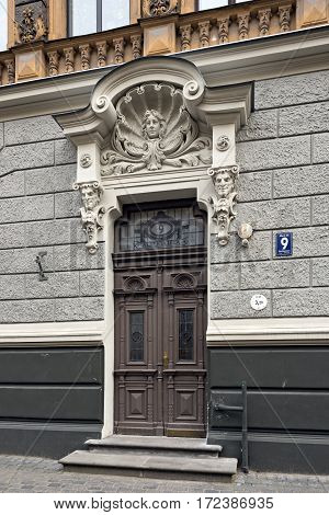 RIGA/ LATVIA - JULY 26. Door of the old apartment building, built in 1905 by Konstantins Peksens in art Nouveau style on Alberta street on July 26, 2015 in Riga Latvia.