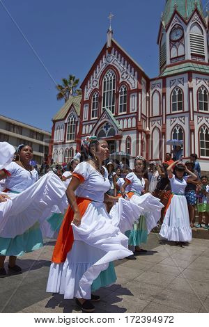 ARICA, ARICA and PARINACOTA, CHILE - FEBRUARY 10, 2017: Female dancers from the group Tumba Carnaval, performing at the annual street carnival celebrating the strength of the sun.