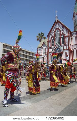 ARICA, ARICA and PARINACOTA, CHILE - FEBRUARY 10, 2017: Men and women of the group Thinkus Rupay Masis, performing at the annual street carnival celebrating the strength of the sun.
