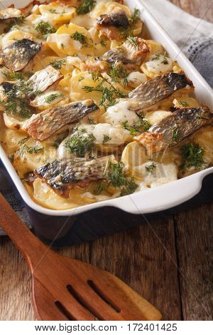 Finnish Cuisine: Kalalaatikko With Potatoes And Herring Close Up In Dish. Vertical