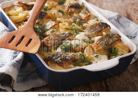 Casserole Of Potatoes, Herring In Cream Sauce In Baking Dish. Horizontal
