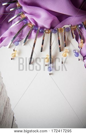 elegant background for design including postcard for text drapery and metal necklace