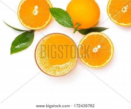 Top view of orange juice in glass and orange fruits with green leaves isolated on white background.