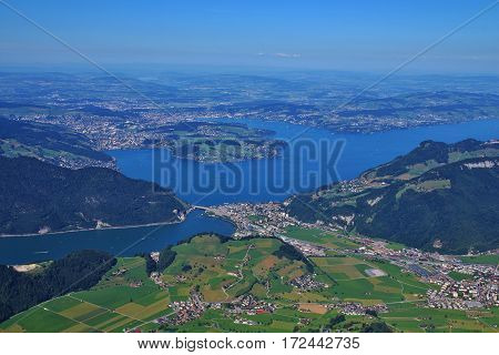 Lake Vierwaldstattersee Lucerne and green meadows. View from mount Stanserhorn.