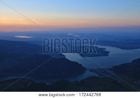 View from mount Stanserhorn. Lake Vierwaldstattersee and Lucerne just before sunrise.