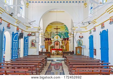 PUTTALAM SRI LANKA - NOVEMBER 25 2016: The interior of St Mary Church decorated with small sculptures and painted altar on November 25 in Puttalam.