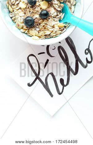 concept kid breakfast with muesli top view on white background.