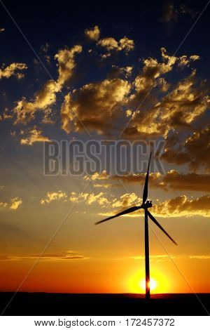Power generated by wind with winmill blowing sky clouds sunset sunrise