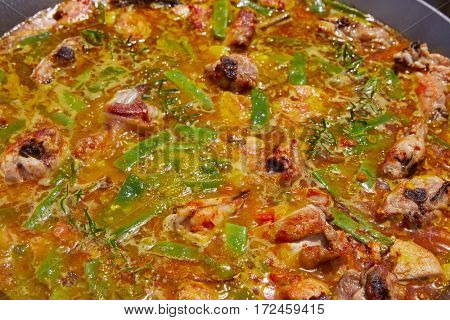 Paella from Spain recipe process boiling broth step by step