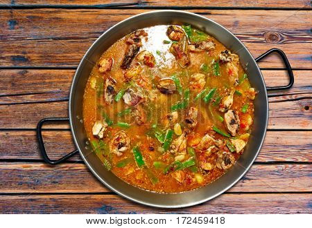 Paella from Spain recipe process ad water to get the broth boil