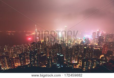 Beautiful super wide-angle summer aerial view View of Hong Kong island skyline, Victoria Bay harbor, with skyscrapers, blue sky and scenery beyond the city, seen from Kowloon island observation Deck