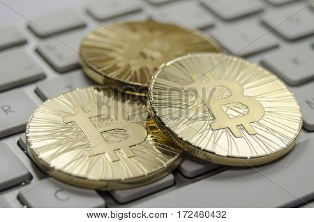 Shiny Gold Bitcoin Coin Laying On White Keyboard