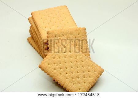 Stacked plain bisuits on a white background