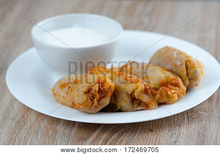 stuffed cabbage - a traditional Ukrainian cuisine braised cabbage leaves stuffed with minced meat and rice with sour cream