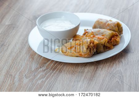 stuffed cabbage - a traditional Ukrainian cuisine braised cabbage leaves stuffed with minced meat and rice with sour cream
