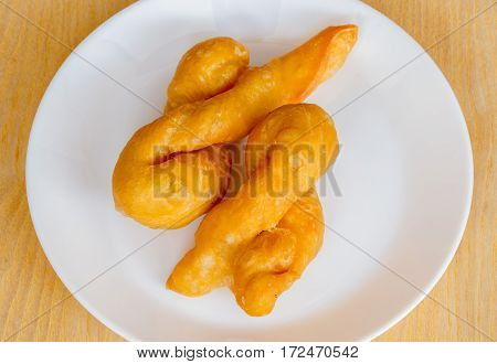 'patongko' thai and chinese food deep fried for breakfast on plate white