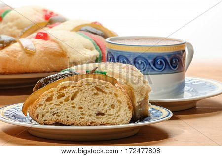 Chocolate cup with Epiphany cake Kings cake Rosca de reyes or Roscon de reyes