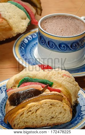 Chocolate cup with Epiphany cake Kings cake Rosca de reyes or Roscon de reyes