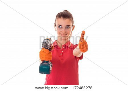 smiling young girl is stretched out in a hand drill and shows the class of isolated on white