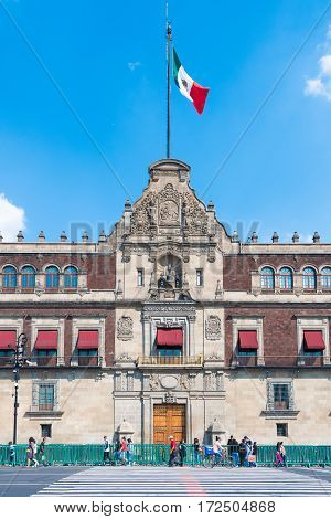 Mexico City Mexico - October 15 2016: People walking by National Palace during the International Book Fair in Mexico City Mexico.