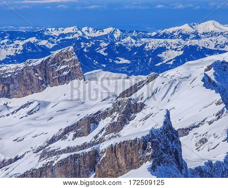 View from Mt. Titlis in Switzerland in winter. The Titlis is a mountain in Switzerland, located on the border between the Swiss cantons of Obwalden and Bern.