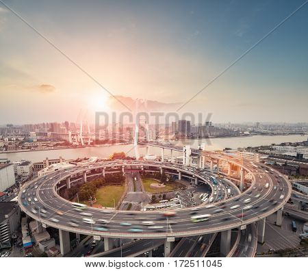 shanghai nanpu bridge at dusk vehicles motion blur as busy traffic background