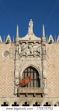 Doge Palace beautiful renaissance balcony with old Venice Republic flag and Saint Mark Lion