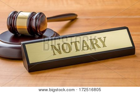 A Gavel And A Name Plate With The Engraving Notary