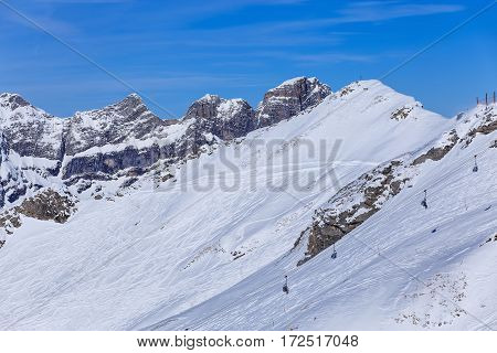 Wintertime view from Mt. Titlis in Switzerland. The Titlis is a mountain, located on the border between the Swiss cantons of Obwalden and Bern.