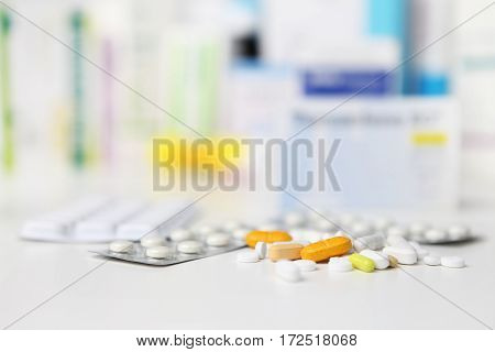 pills and blister medicine capsule drugs and tablet boxes in background